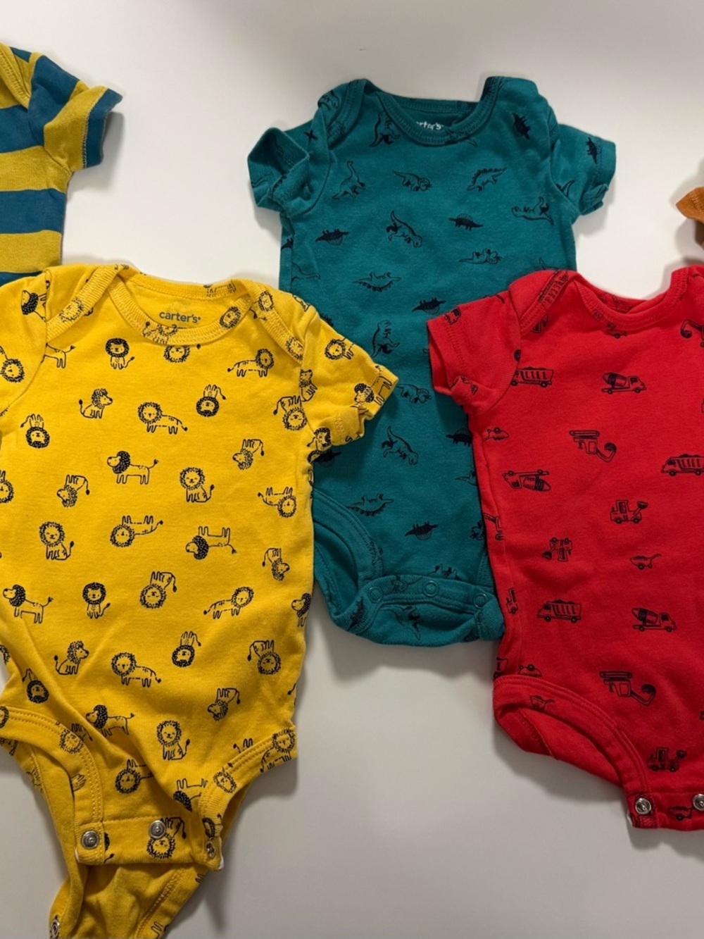 Carter's Yellow Lion, Teal Dino, Red Truck and Striped Baby One-Pieces